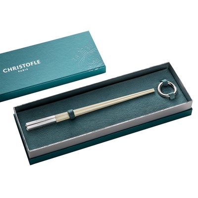 Set of two white Chinese chopsticks and chopsticks rests