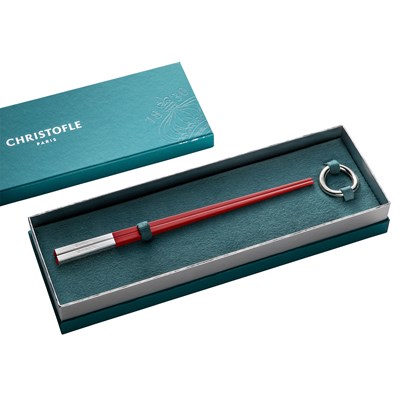 Red Chinese chopsticks and Vertigo chopsticks rest